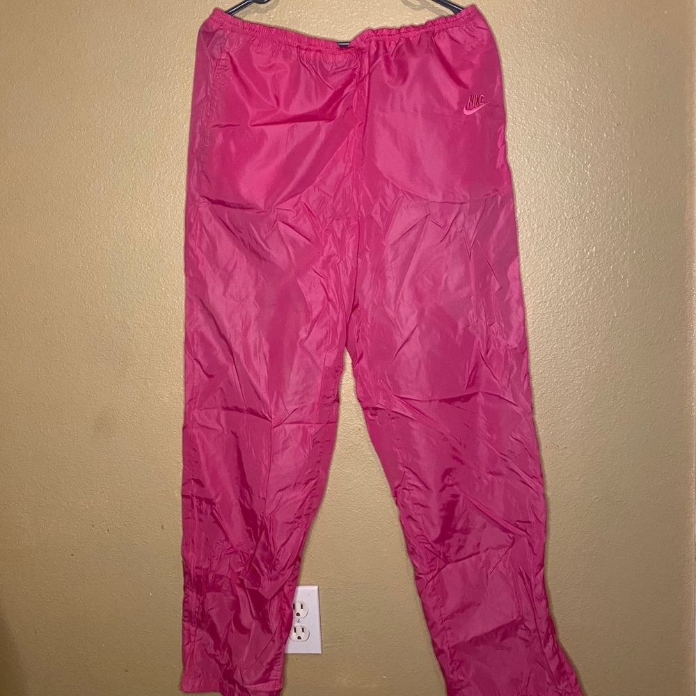 Pink Nike windbreaker pants